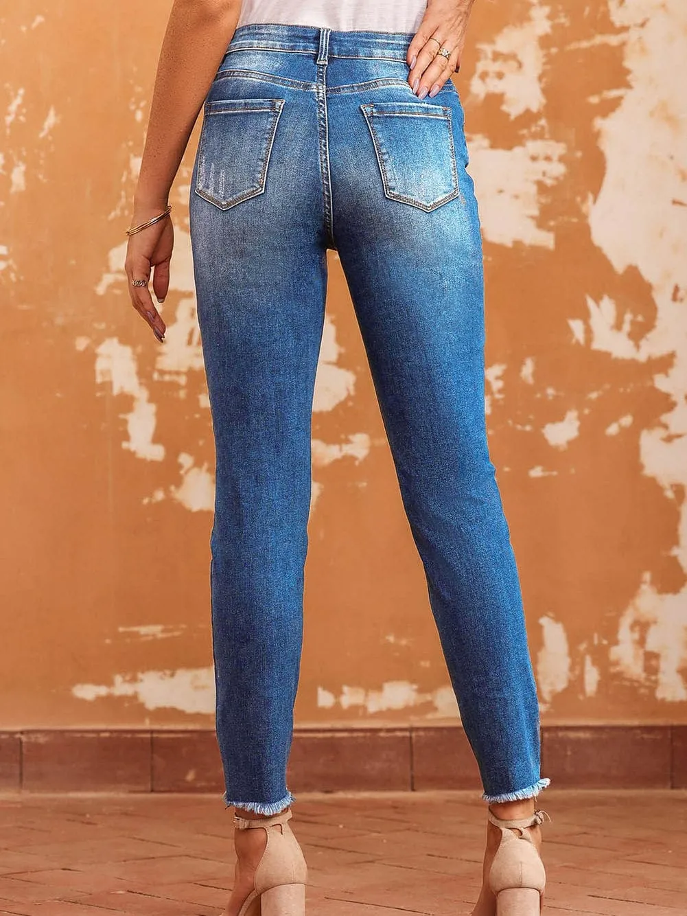 Blue Distressed Skinny Jeans with Raw Hem and Ankle-Length Cut