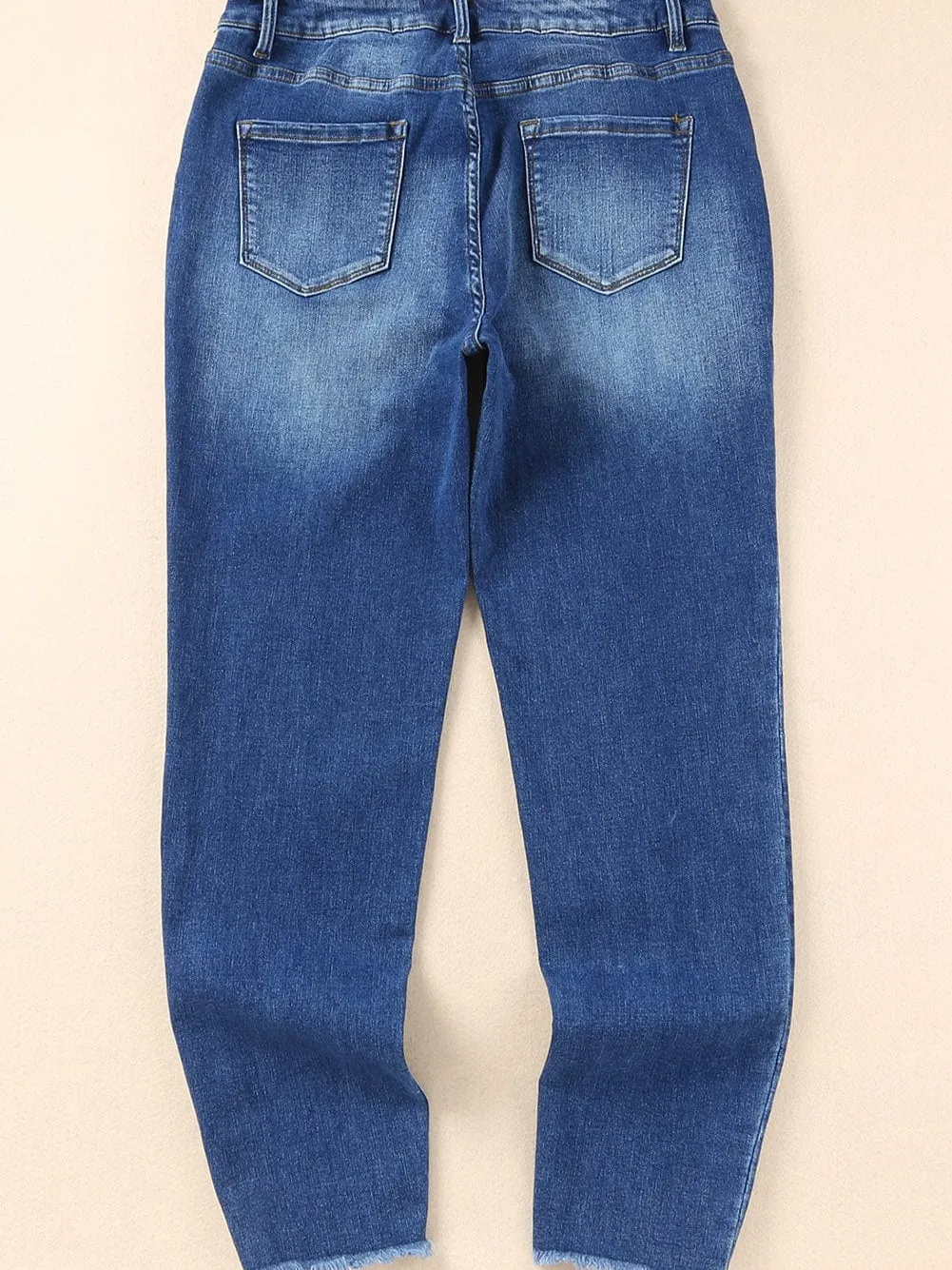 Blue Distressed Skinny Jeans with Raw Hem and Ankle-Length Cut